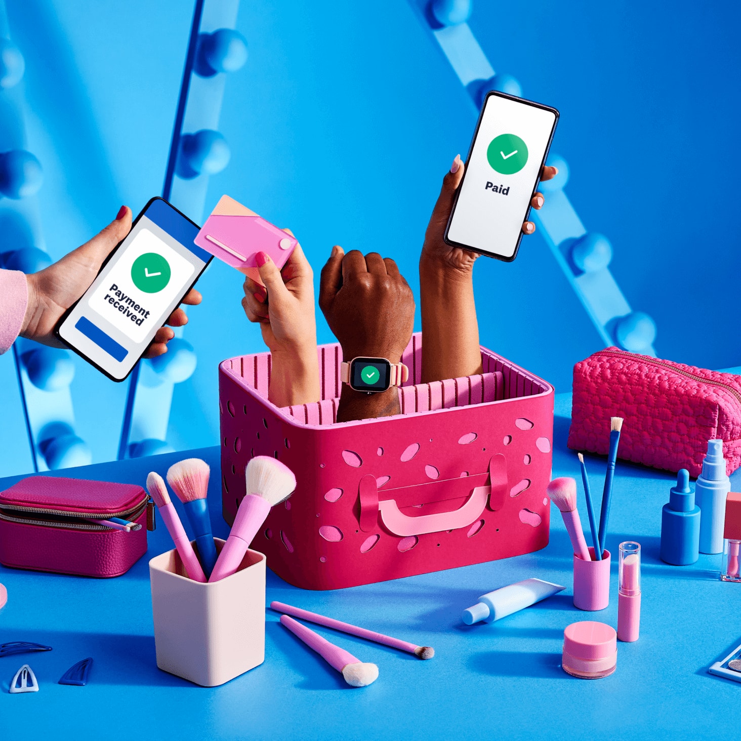 Makeup, beauty care products and a client paying for their appointment using their phone.