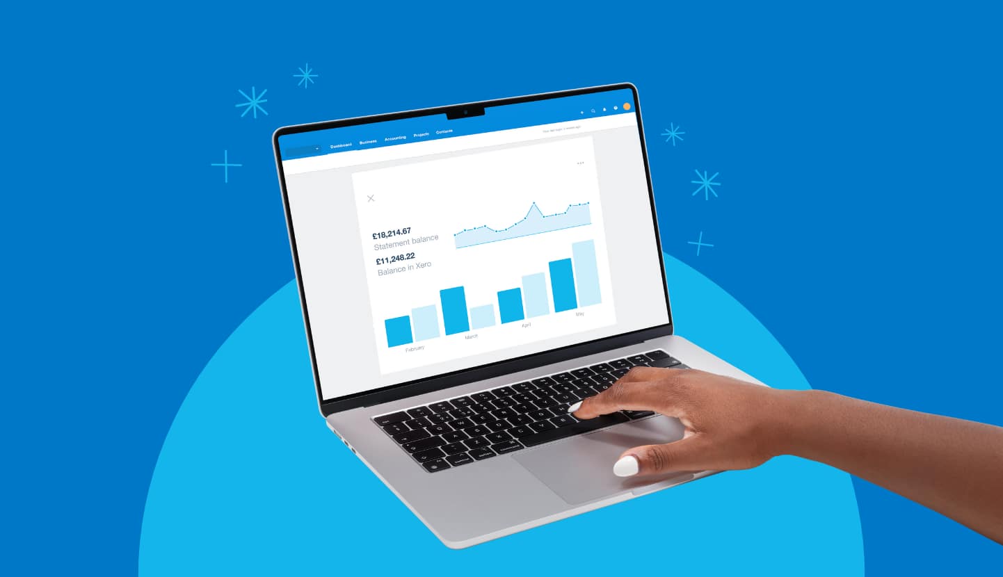 A small business owner managing finances with cash flow forecasting software on a laptop.