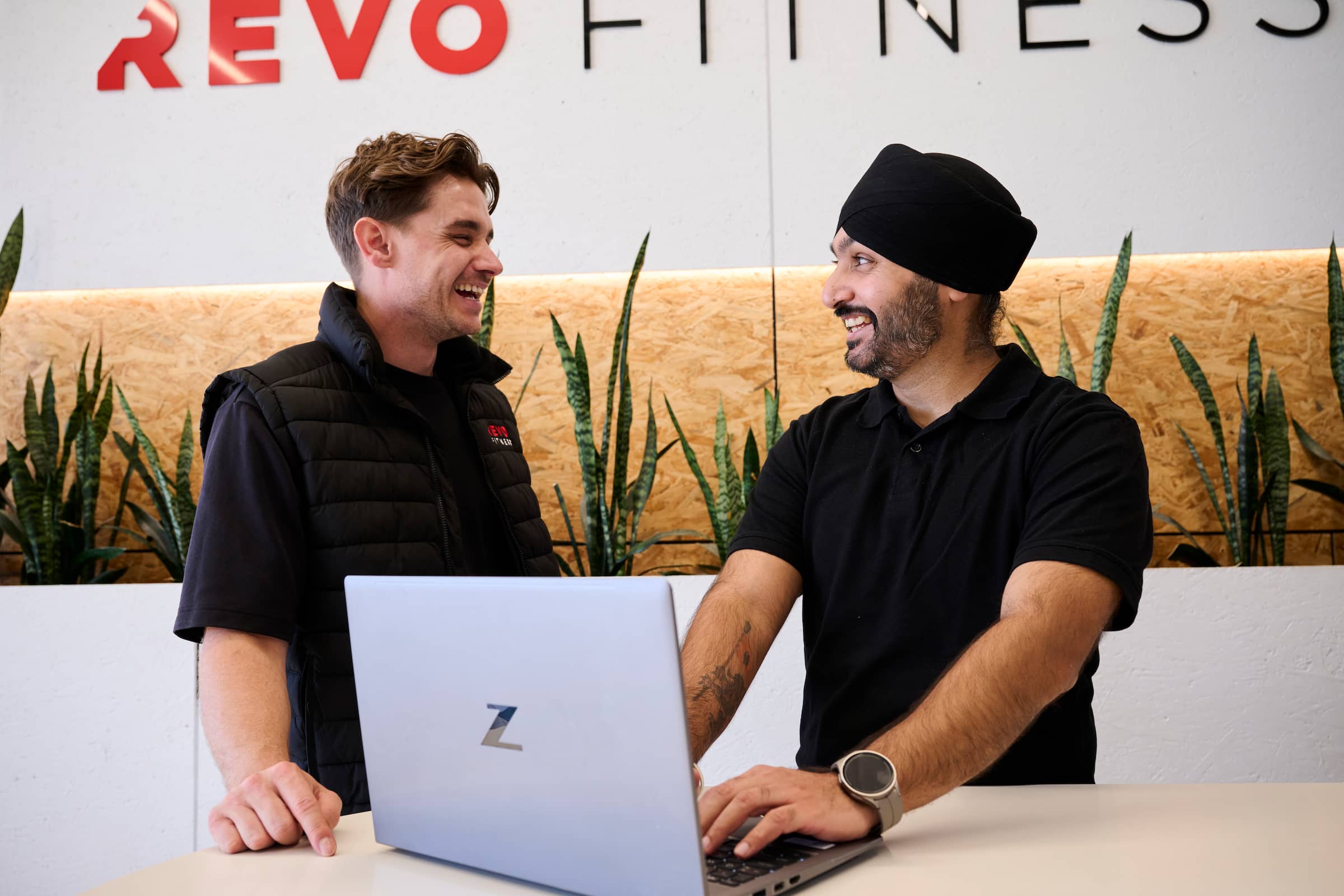 A gym owner discussing Xero's accounting software with their business partner.