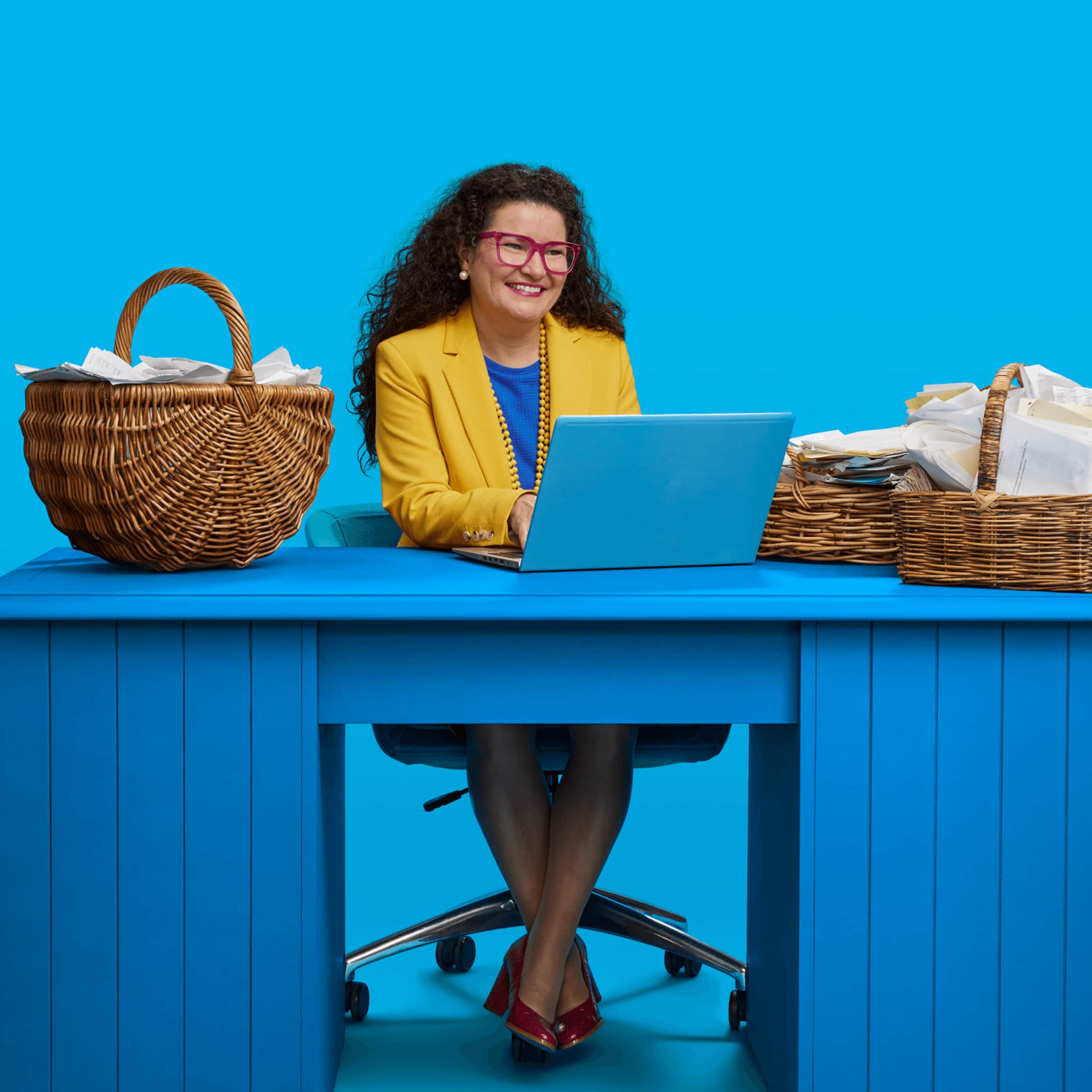 A business owner works happily online with her accountant on preparing her accounts for end of fiscal year, United States.