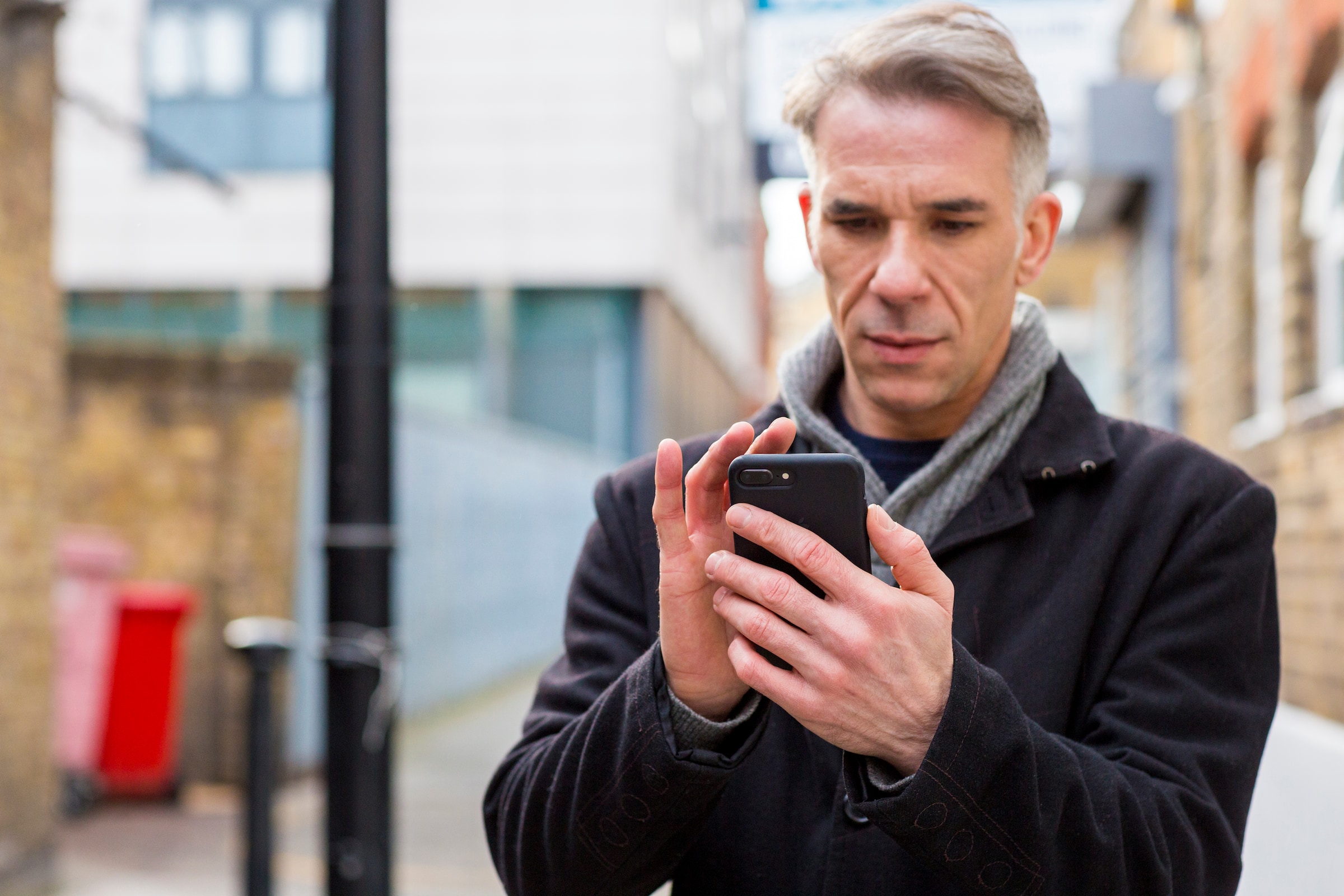 A transportation business owner using Xero's accounting software on their phone.