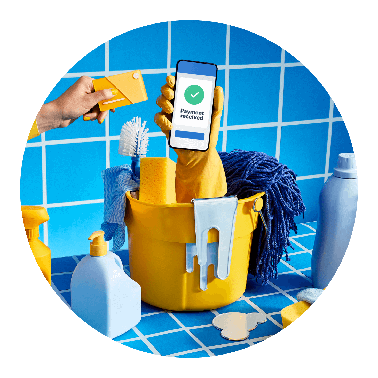 A bucket, mop, cleaning sprays and a client paying the cleaner using Tap to Pay on Xero on their phone.