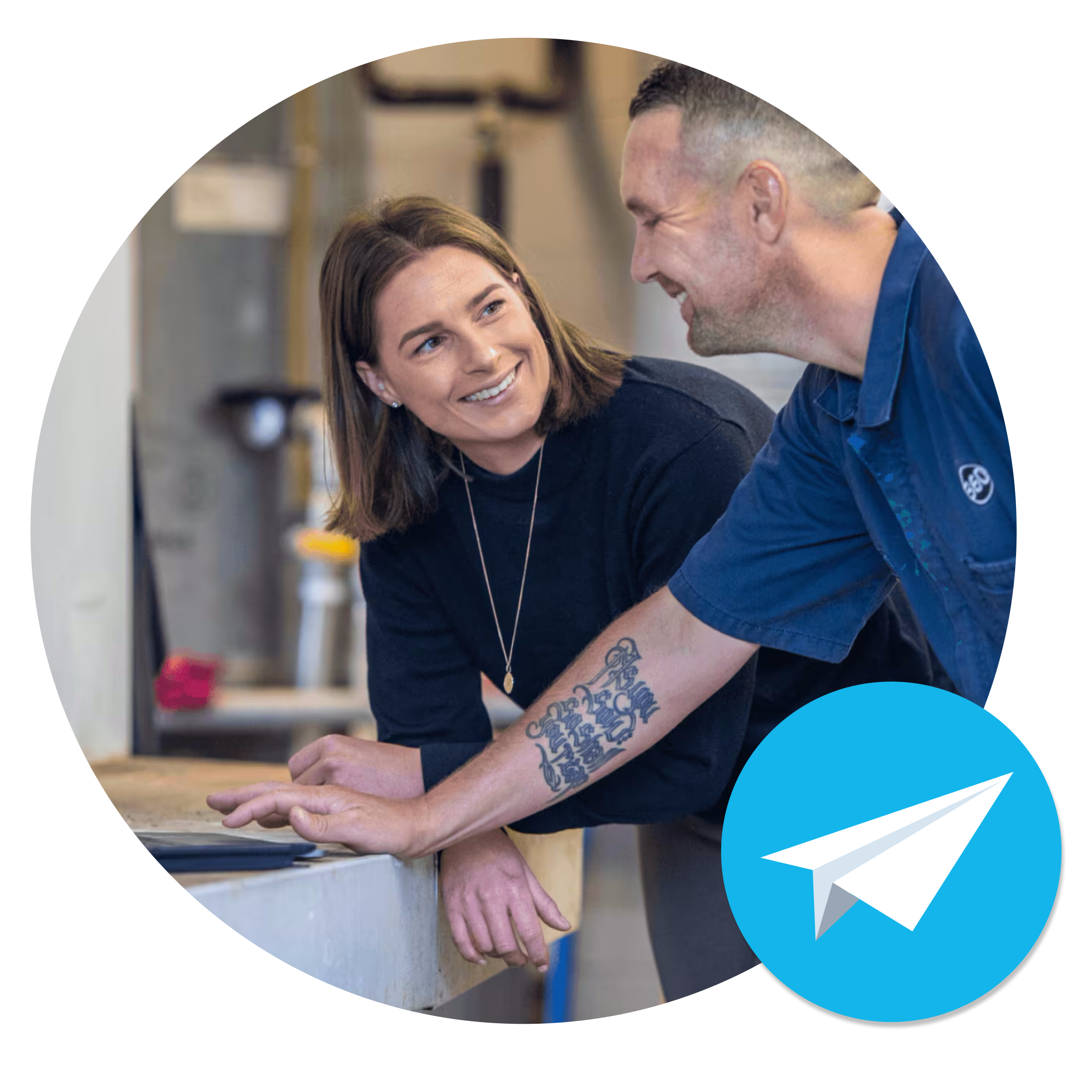 A tradesperson shares a light-hearted moment with a colleague while using Xero invoicing software.