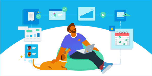 Man sitting with his dog working on his laptop. 